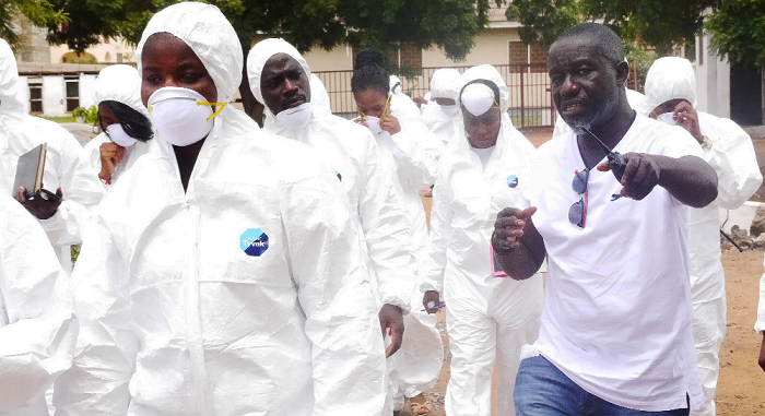 Mr Kwame Awuku-Adu, the Managing Director of Delawin Farms Limited, with journalists on a tour of his farm